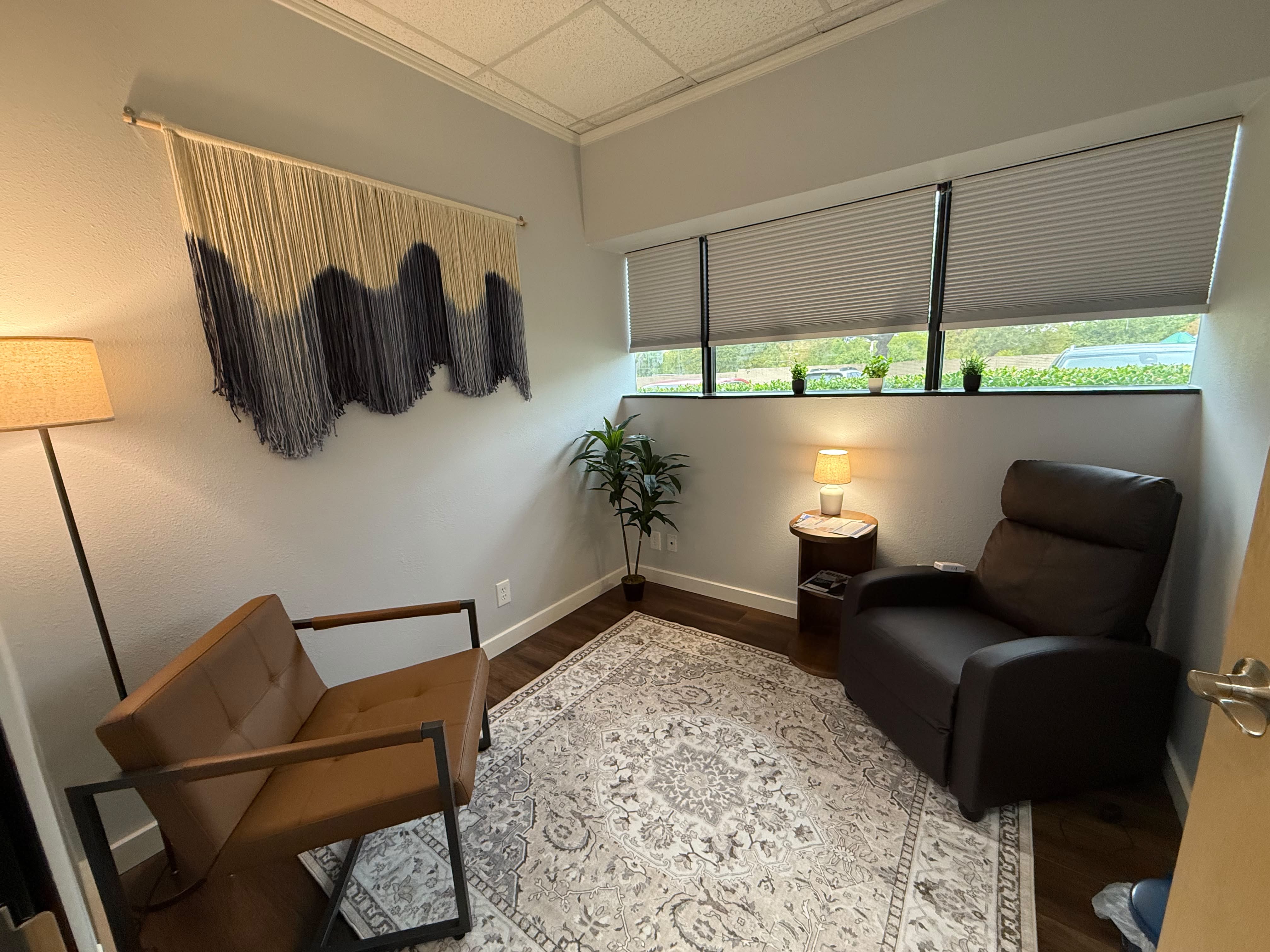 Calm, comfortable psychiatry treatment room at Premier Psychiatry in Richardson, TX